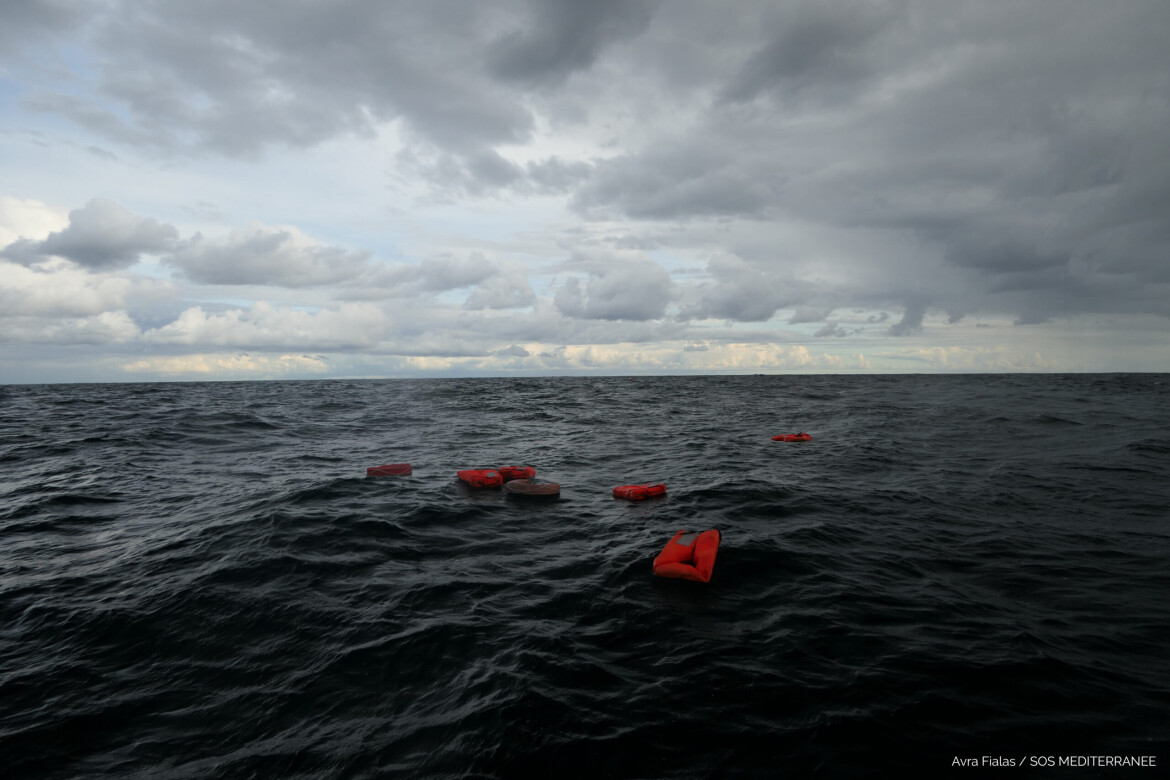 Life jackets floating at sea during rescue training exercises.
